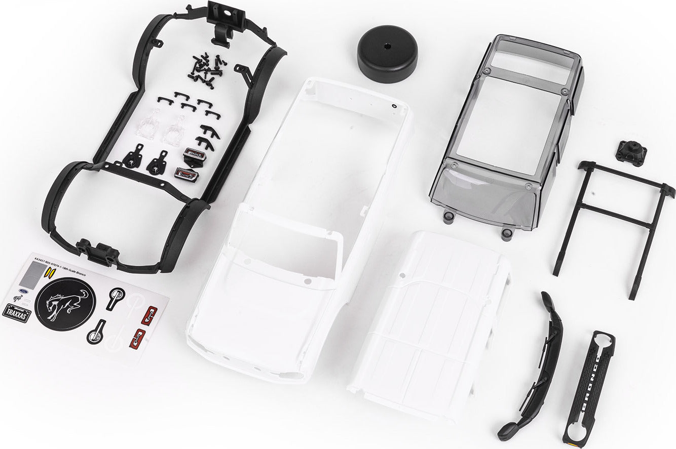 Body, Ford Bronco, complete (unassembled) (white, requires painting) (includes grille, side mirrors, door handles, fender flares, windshield wipers, spare tire mount, & clipless mounting) (requires #9735 front & rear bumpers)